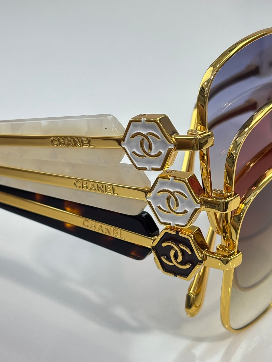 Chanel sunglasses side view with gold-tone arms and logo details