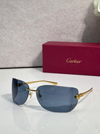 Cartier sunglasses with gold frame and blue-tinted shield lenses