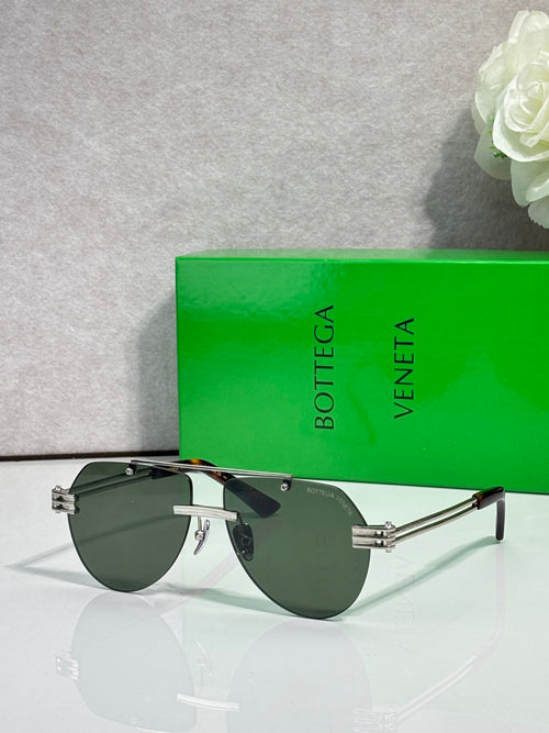 Bottega Veneta sunglasses, gold-tone frame with dark green tinted lenses