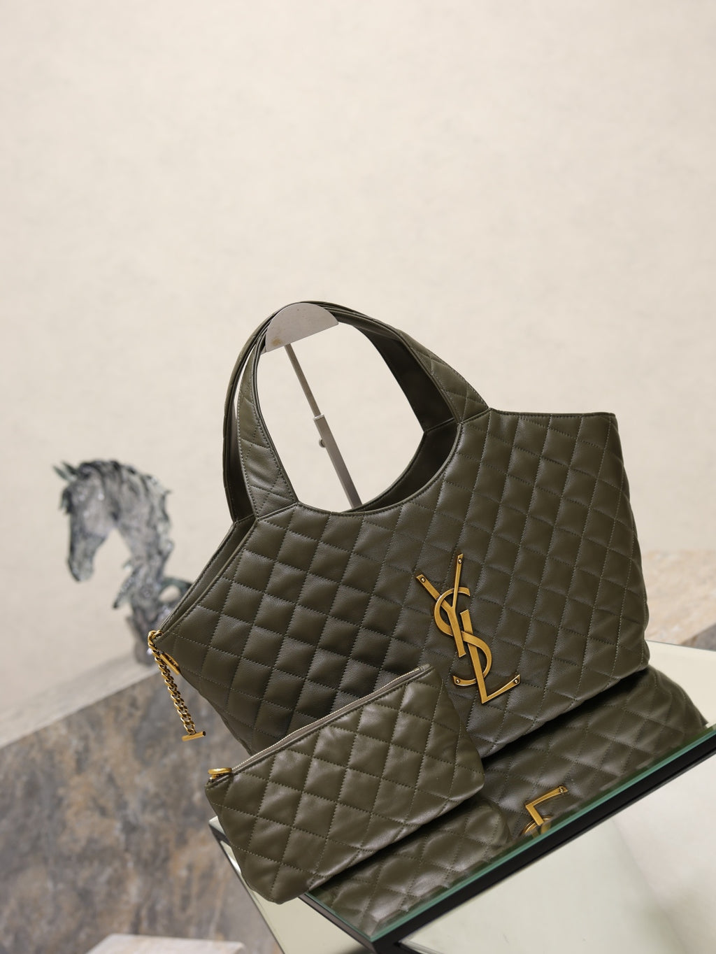 YSL quilted tote bag in dark olive green with YSL emblem and chain strap