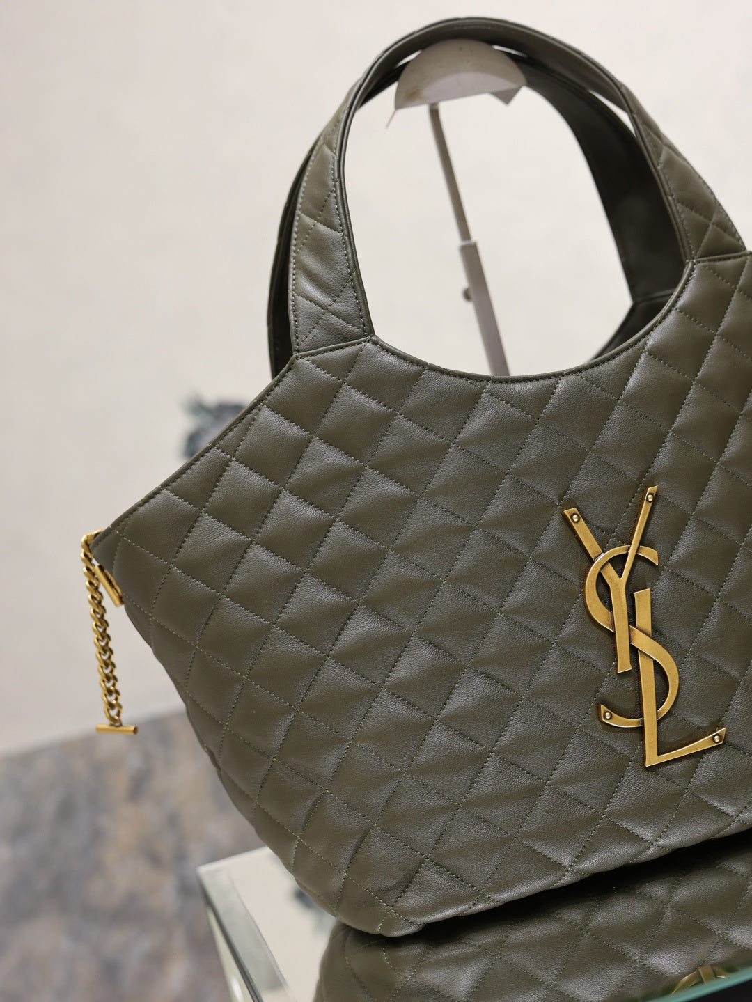 YSL quilted olive green tote bag with YSL logo on the side