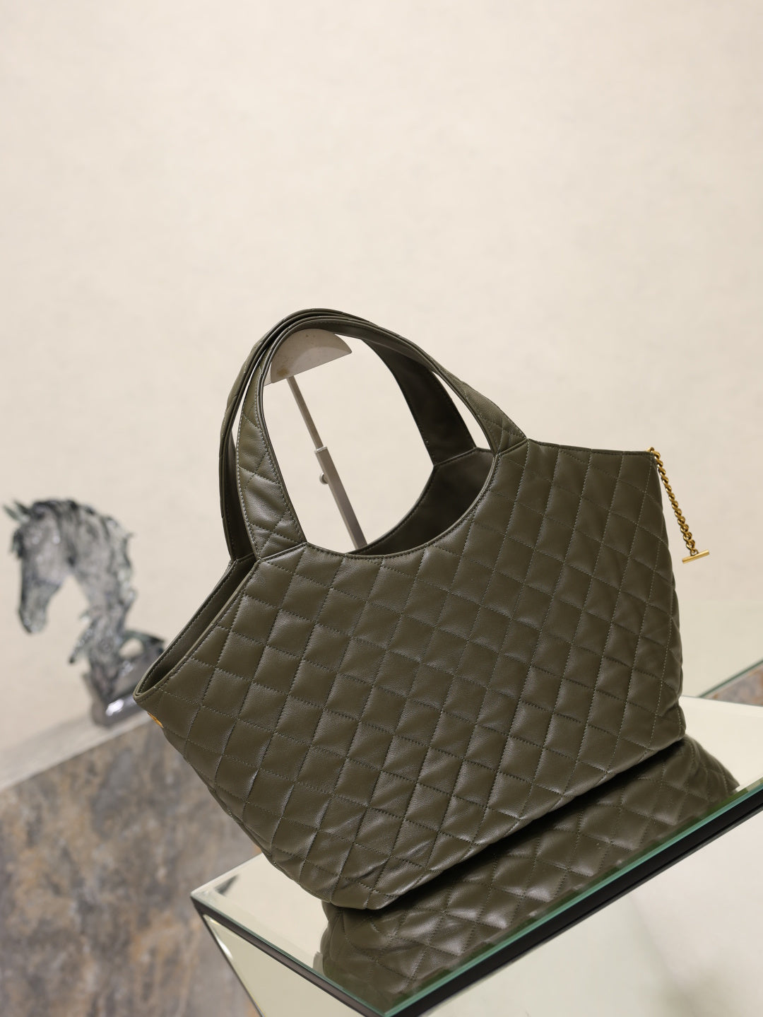YSL quilted olive green tote bag with top handles and gold YSL charm