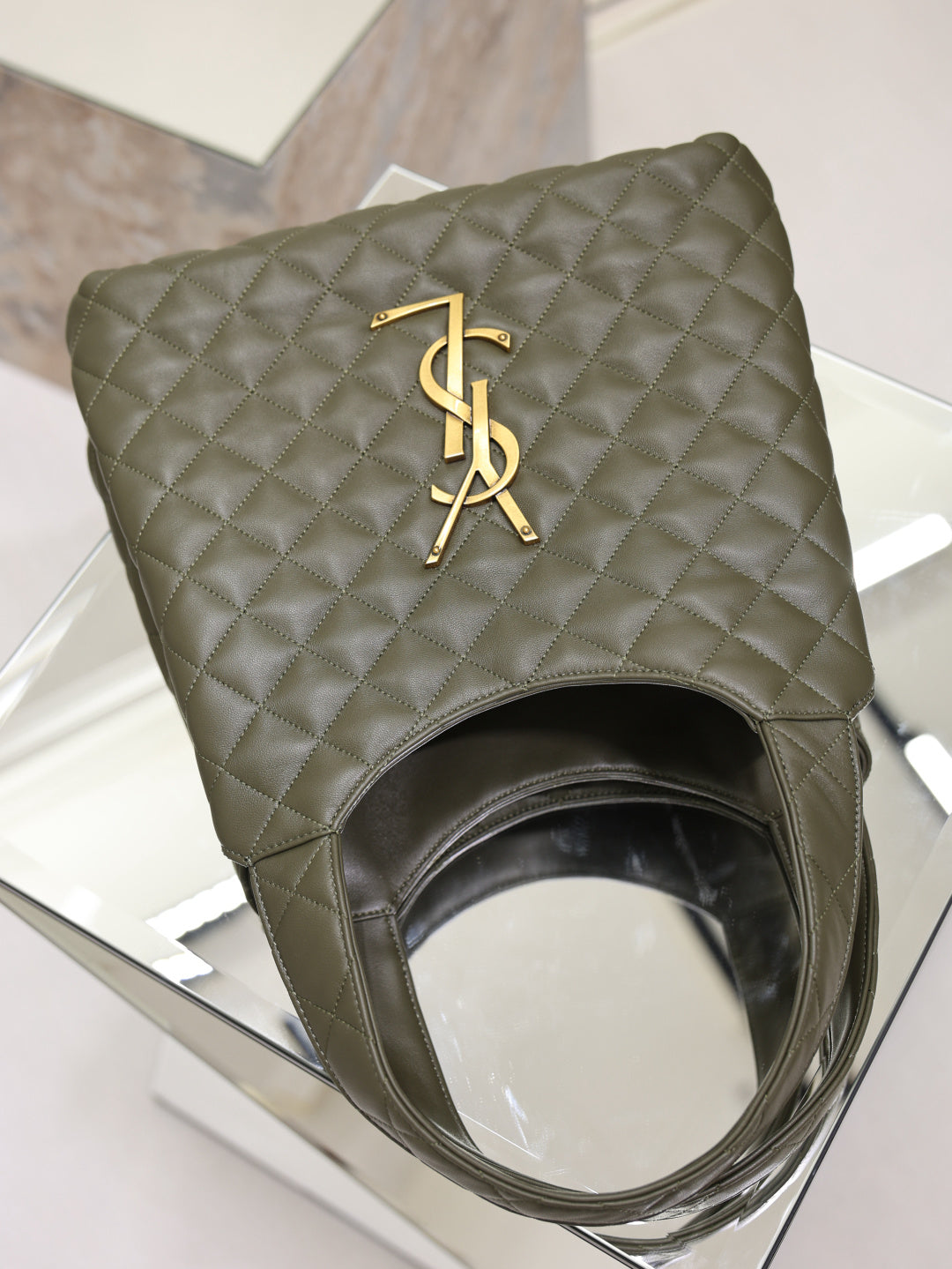 YSL quilted olive green tote bag with gold YSL logo and curved open top