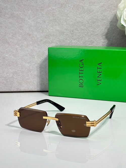 Bottega Veneta glasses with brown lenses, gold frame, and black temples