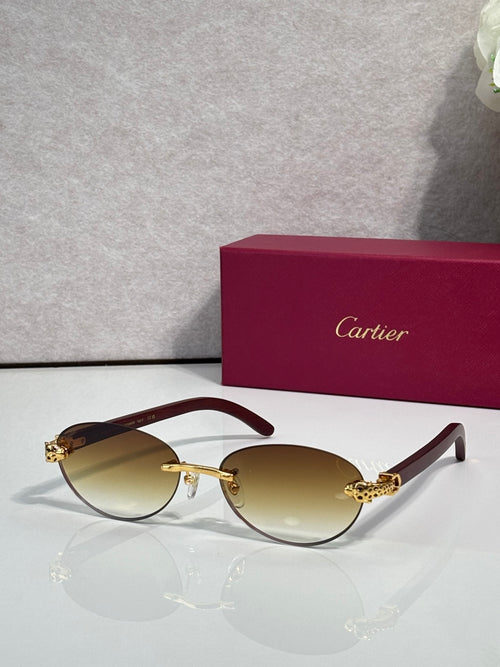 Cartier eyeglasses with dark brown frame and light amber lenses, gold detailing