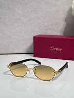 Cartier eyeglasses with dark brown frame and pale yellow lenses, gold temple accents