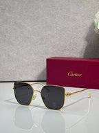 Rectangular sunglasses with gold frame and black mirrored lenses