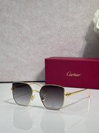 Rectangular sunglasses with gold frame and dark gray mirrored lenses
