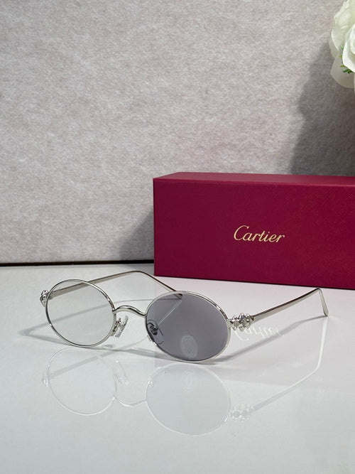 Cartier round metal glasses with clear lenses and light gray tints