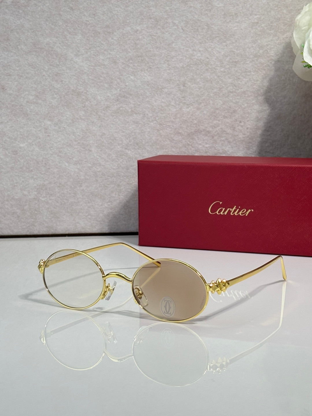Cartier round metal glasses with gold frame and clear lenses