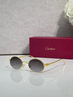 Cartier round metal glasses with gold frame and dark gray lenses
