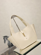 YSL cream tote bag, structured shape with gold emblem hardware