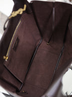 YSL bag interior with brown lining and zip pocket shown at open top