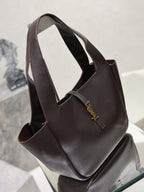 YSL bag tote with dark pebbled leather, wide opening, and gold logo charm