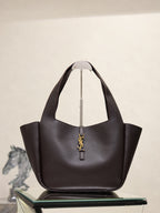 YSL bag tote in dark pebbled leather with gold YSL charm at front