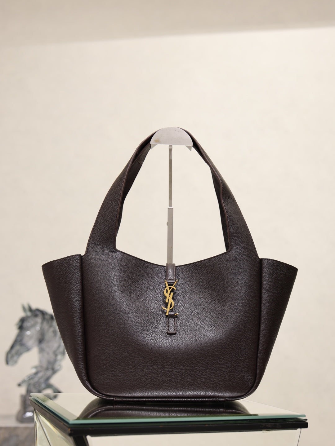 YSL bag tote in dark pebbled leather with gold YSL charm at front