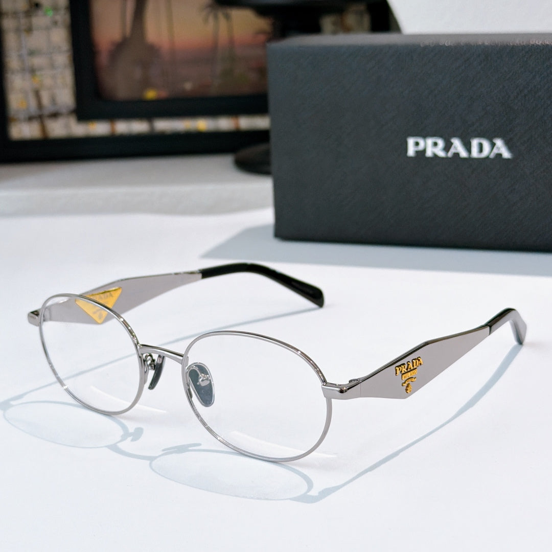 Prada eyeglasses with silver metal round frames, clear lenses, black temples