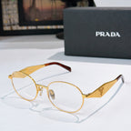 Prada eyeglasses with gold metal round frames and clear lenses