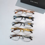 Prada eyeglasses set with mixed metal round frames and clear lenses