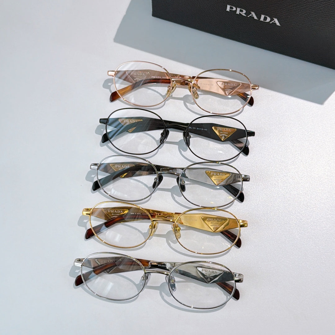 Prada eyeglasses set with mixed metal round frames and clear lenses