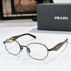 Prada eyeglasses with dark round frames, clear lenses, gold logo temple details