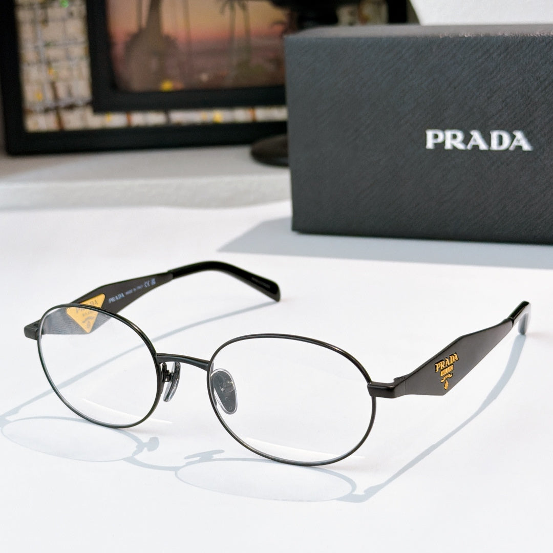 Prada eyeglasses with dark round frames, clear lenses, gold logo temple details