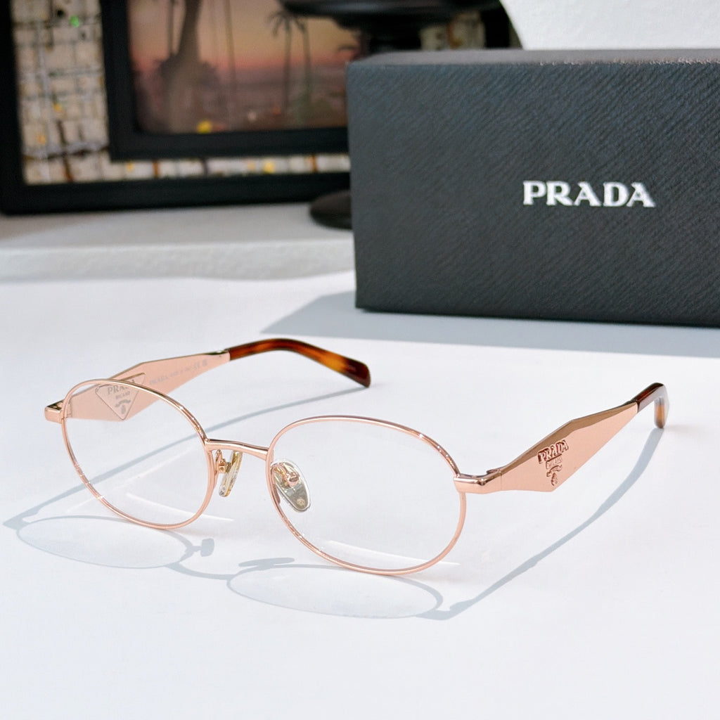 Prada eyeglasses with rose-gold round frames, tortoise temple tips, clear lenses