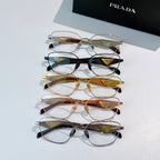 Prada eyeglasses stack with mixed metal frames in clear, gold, and dark tones