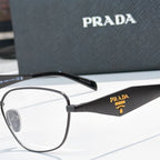 Prada eyeglasses close-up with black frame and gold logo on temple