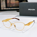 Prada eyeglasses with gold round frames and clear lenses, logo temple tips.