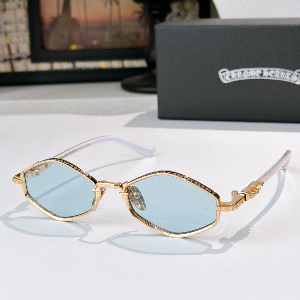 Chrome sunglasses with light blue lenses, gold-tone metal accents, and curved temples.