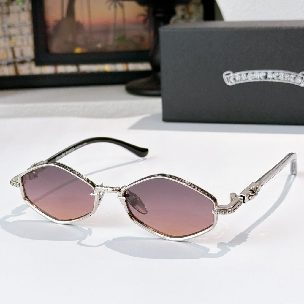 Chrome sunglasses with rose-tinted lenses, metal frame with patterned trim, curved temples.