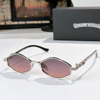 Chrome sunglasses with rose-tinted lenses, metal frame with patterned trim, curved temples.