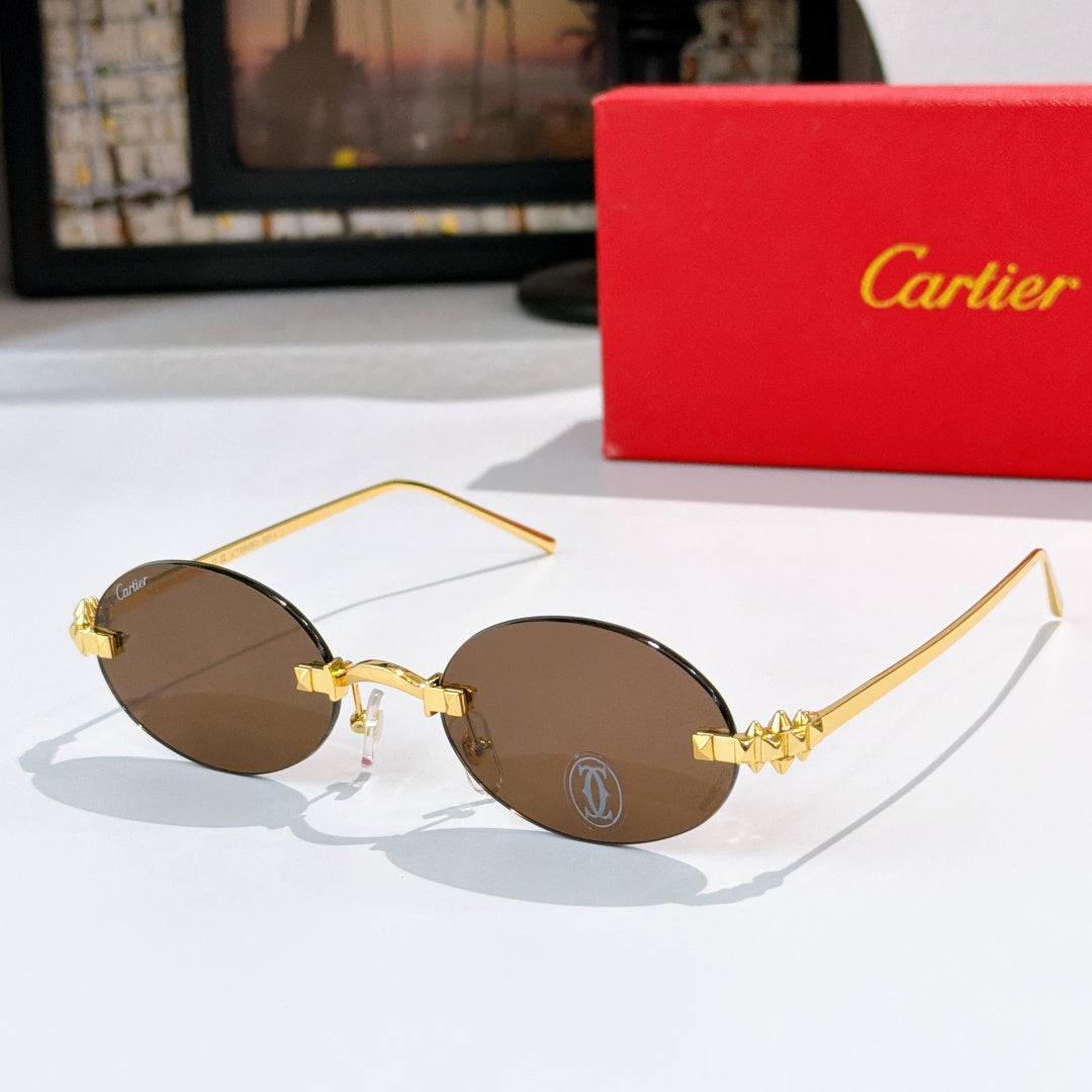 Cartier sunglasses with gold round frames and brown tinted lenses
