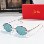 Cartier sunglasses with gold round frames and light blue tinted lenses