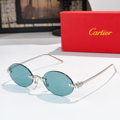 Cartier sunglasses with gold round frames and light blue tinted lenses