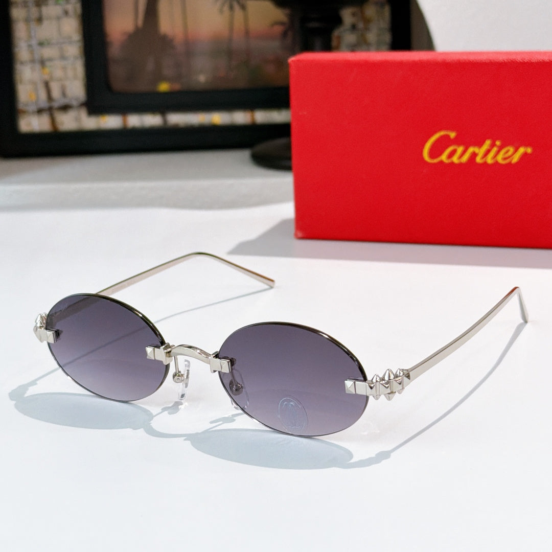 Cartier sunglasses with silver round frames and dark purple tinted lenses