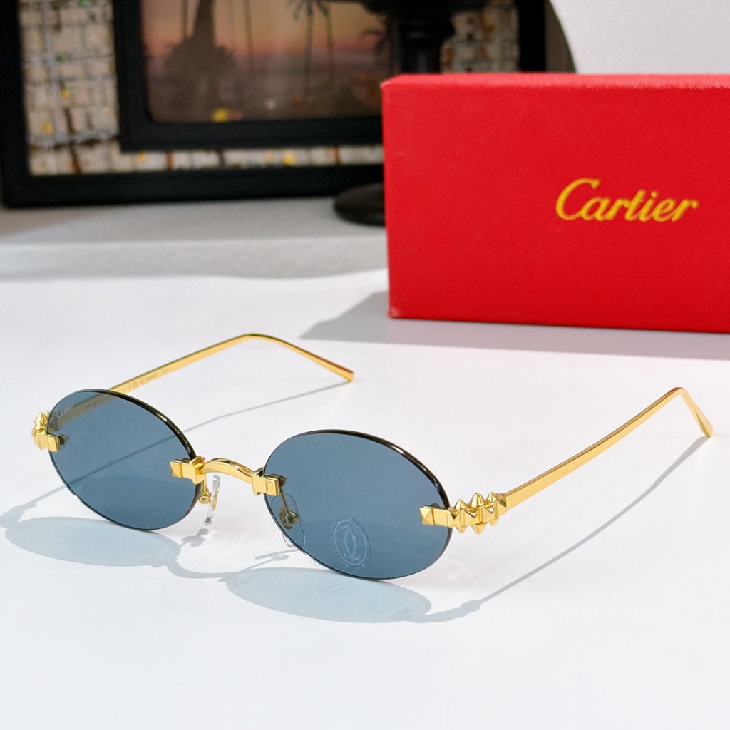Cartier sunglasses with gold round frames and medium blue tinted lenses