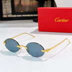 Cartier sunglasses with gold round frames and medium blue tinted lenses