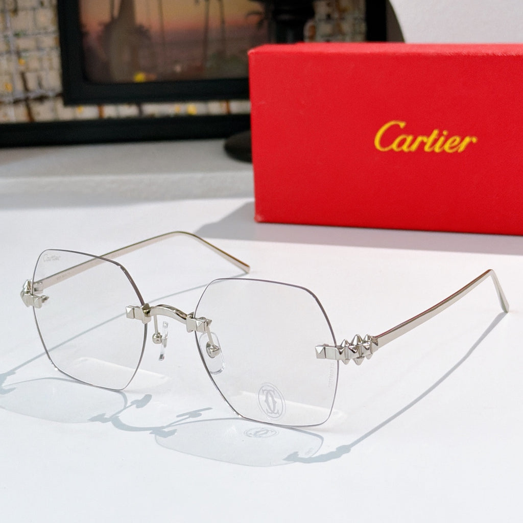 Cartier sunglasses with clear lenses and slim silver frame, patterned gold temple accents