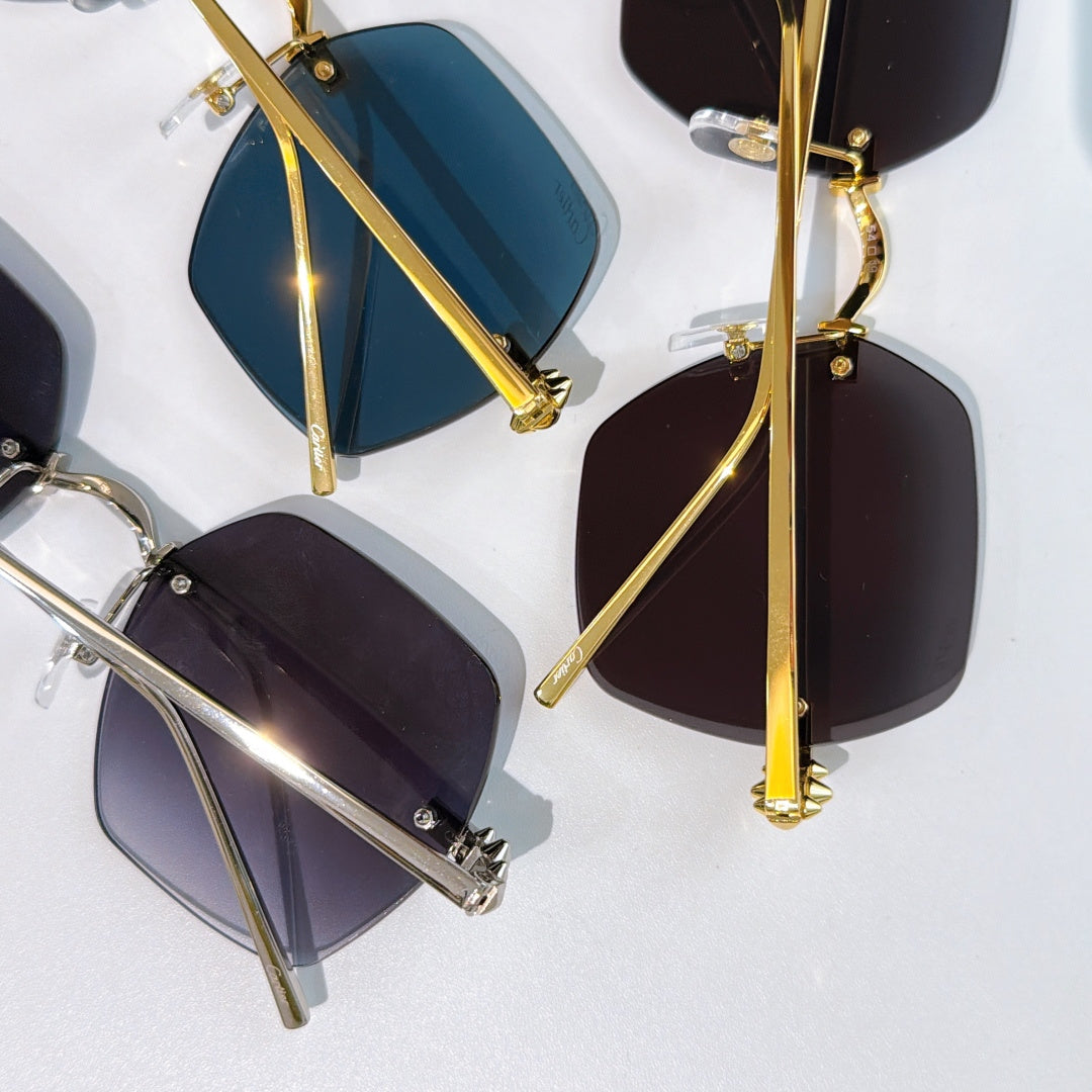 Cartier sunglasses close-up with blue and dark lenses, gold hinges and slim temples