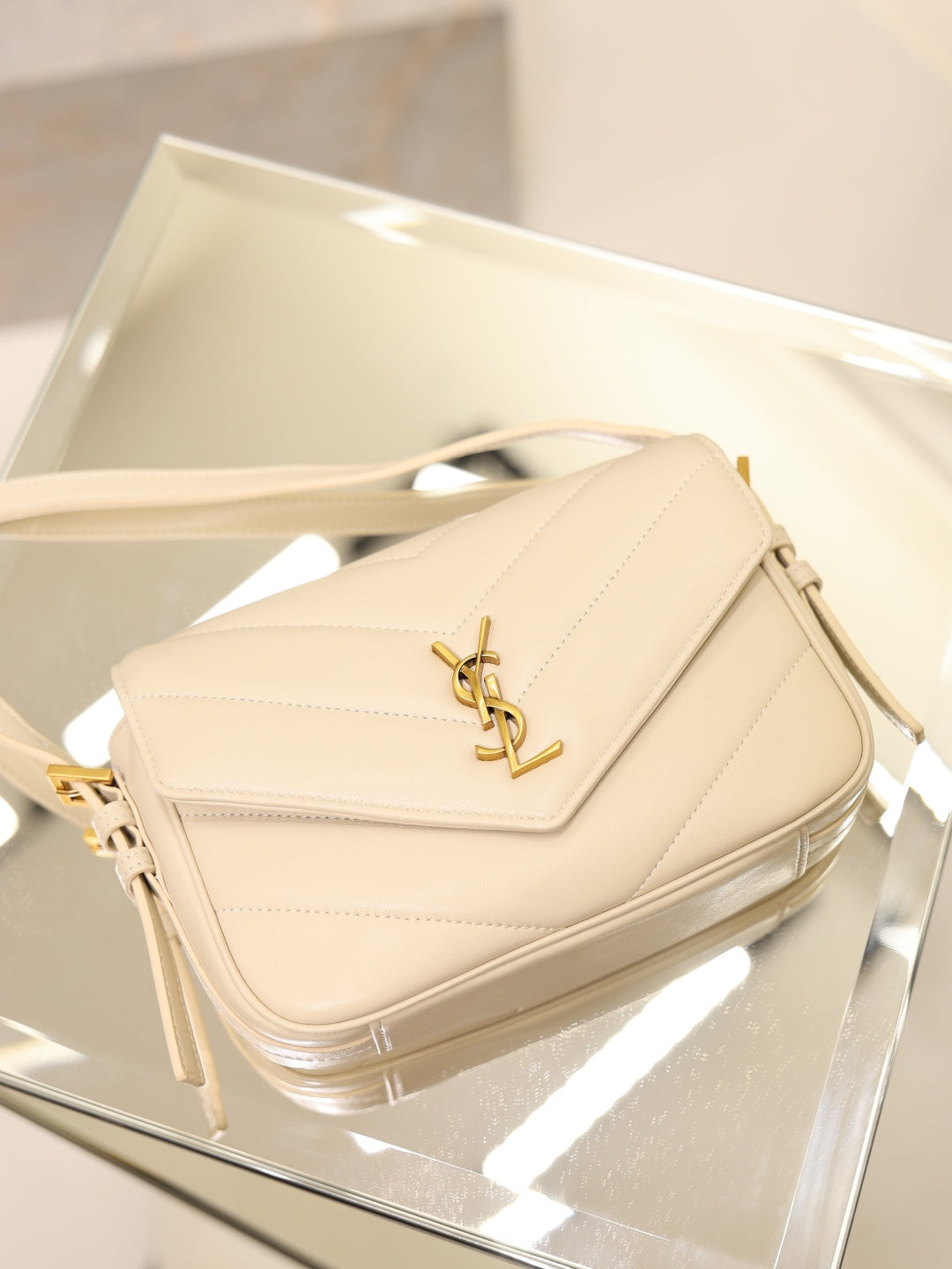 Cream quilted YSL shoulder bag with gold logo and long tassel straps