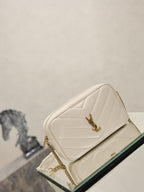 YSL cream quilted shoulder bag with gold chain strap and logo front clasp