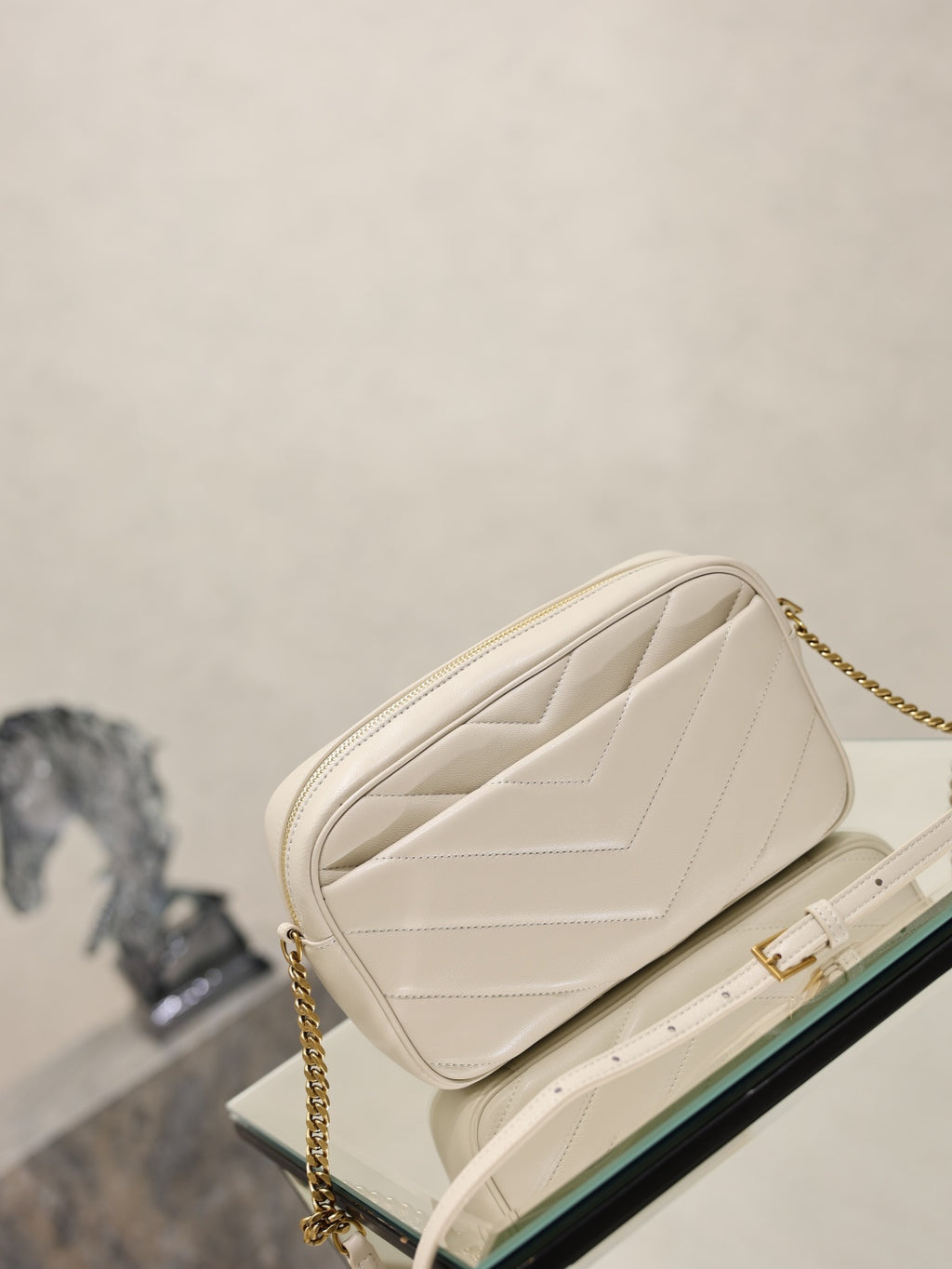 YSL cream quilted shoulder bag with gold chain strap and top flap front