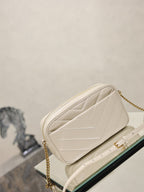 YSL cream quilted shoulder bag with gold chain strap and top flap front