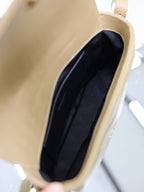 YSL beige crossbody bag interior with dark fabric lining and stitched inner edge
