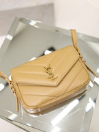 YSL quilted beige crossbody bag front view with flap and gold YSL logo hardware