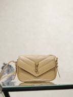 YSL quilted beige crossbody bag with flap, YSL logo, and gold hardware