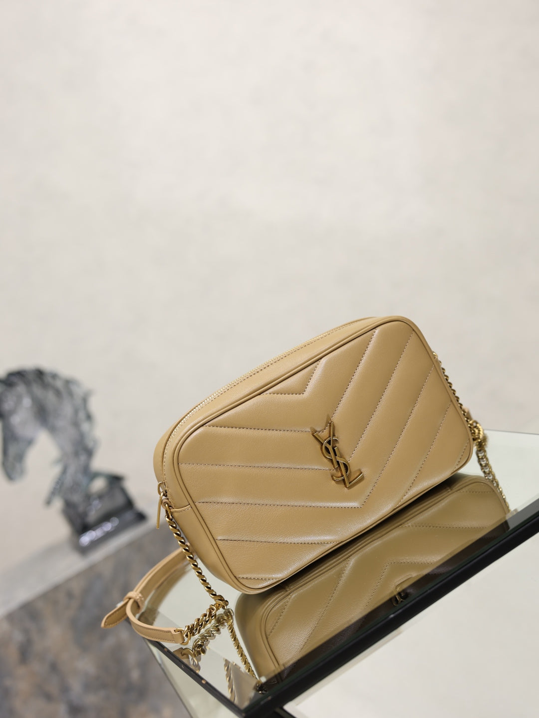 Quilted shoulder bag with YSL logo clasp and gold chain strap, light tan