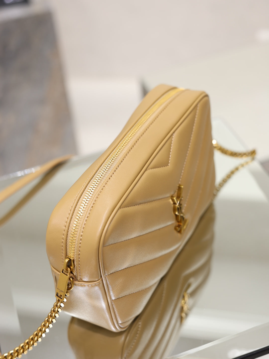 Quilted leather shoulder bag with front zip, gold chain strap, light tan